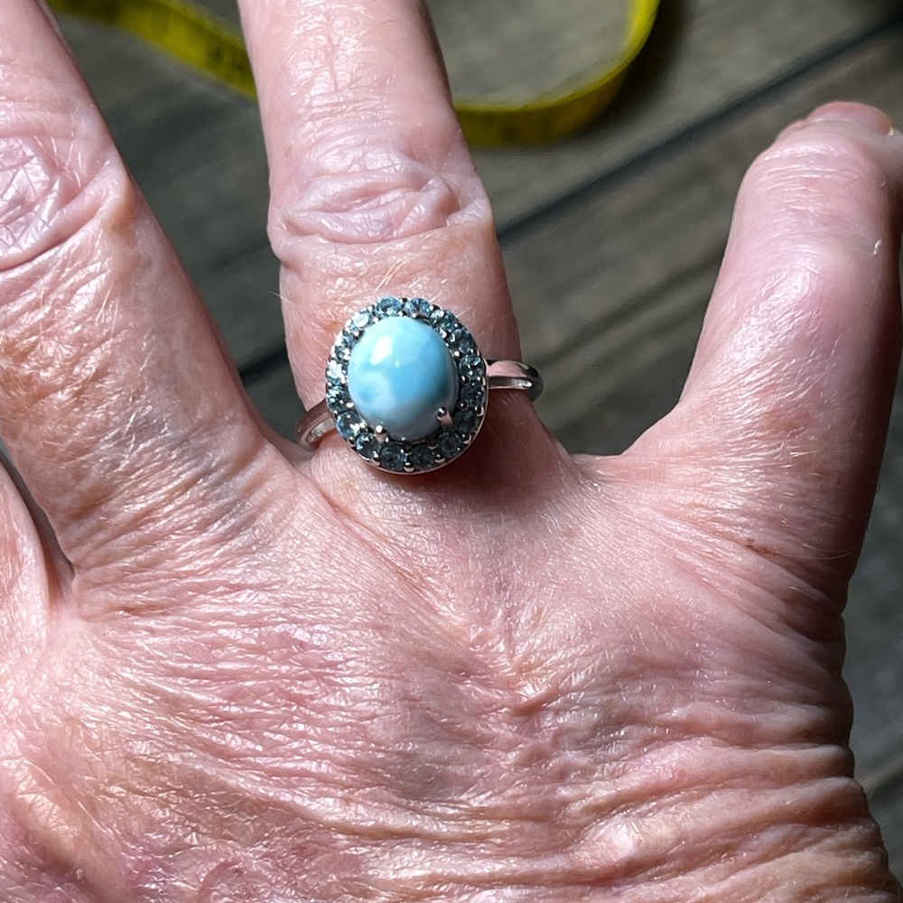 Size 7 Elegant Larimar ring surrounded by blue topaz.